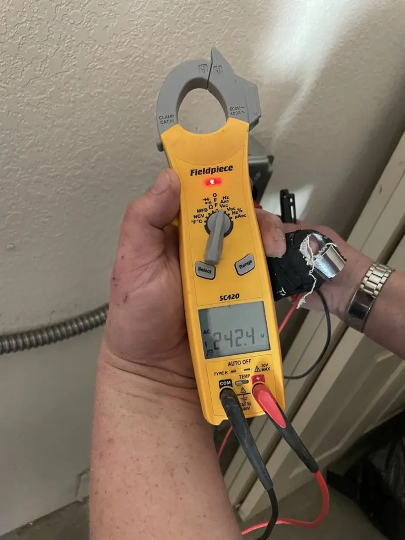 Voltage testing with clamp meter during Circuit Breaker Repair in Harper Woods
